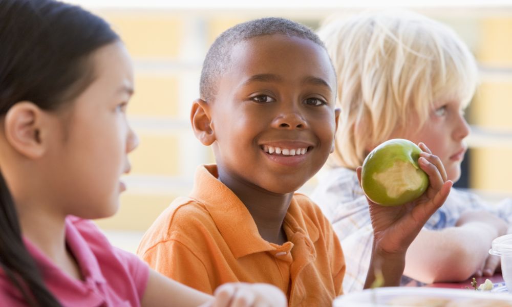 child eating apple