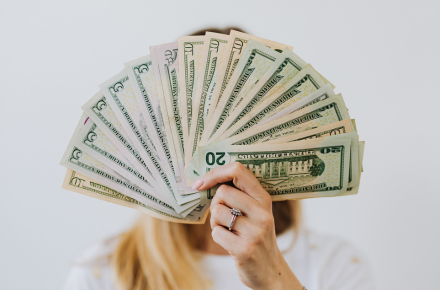 person fanning money