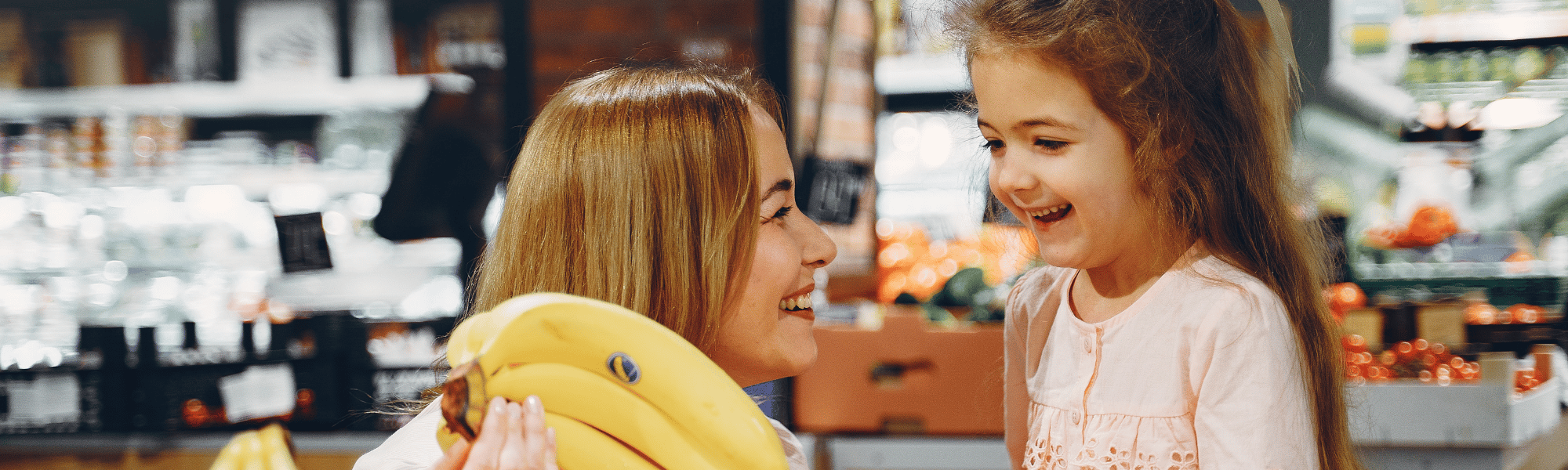 mom and daughter grocery shopping
